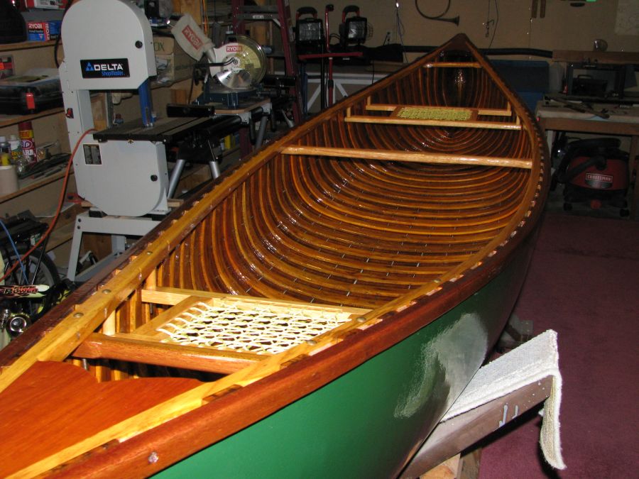 Restored wood and canvas canoes.