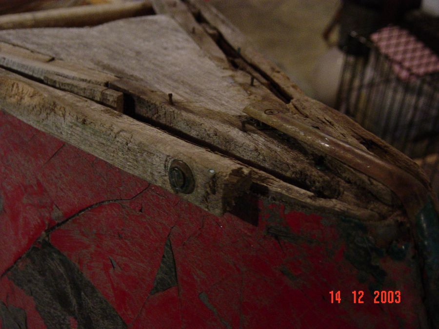 Restored wood and canvas canoes.