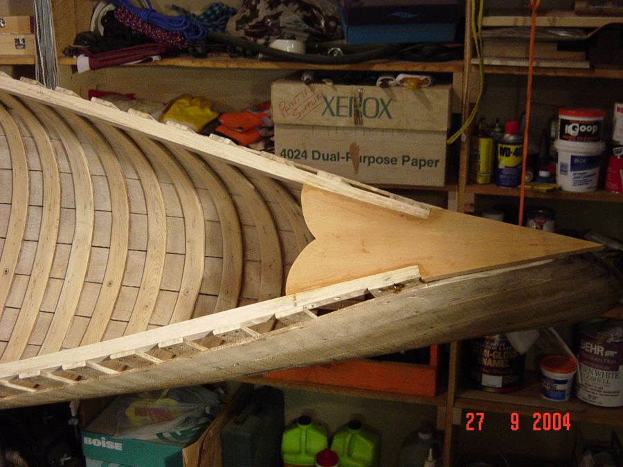 Restored wood and canvas canoes.