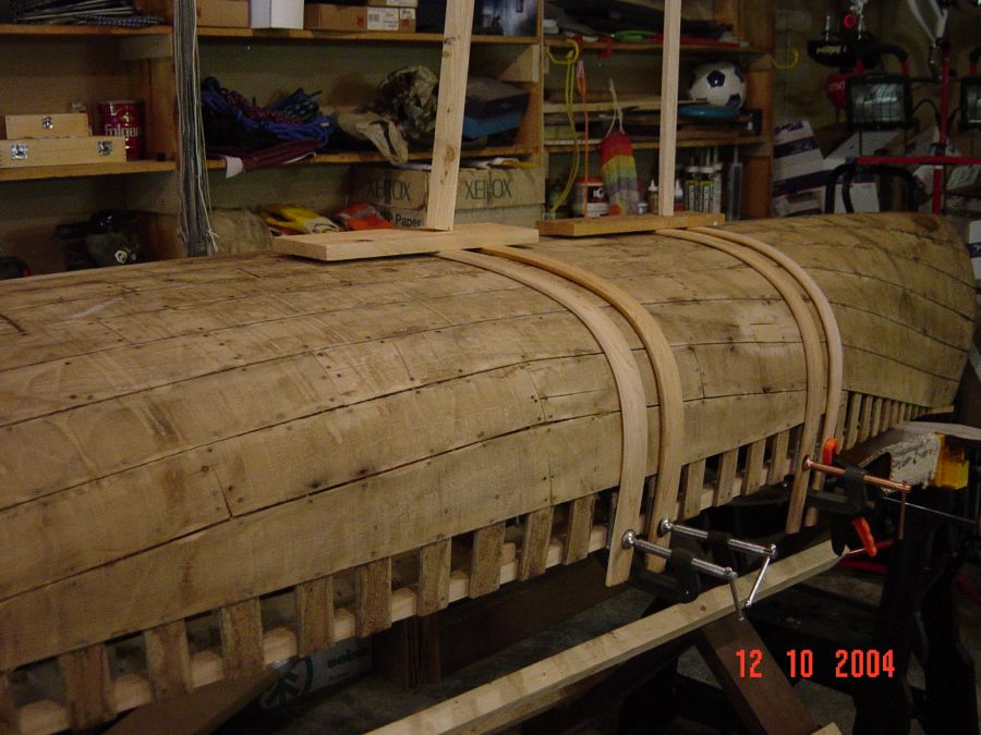 Restored wood and canvas canoes.