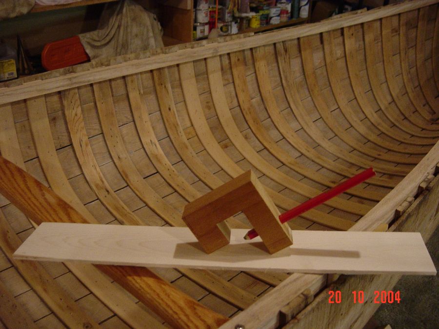 Restored wood and canvas canoes.