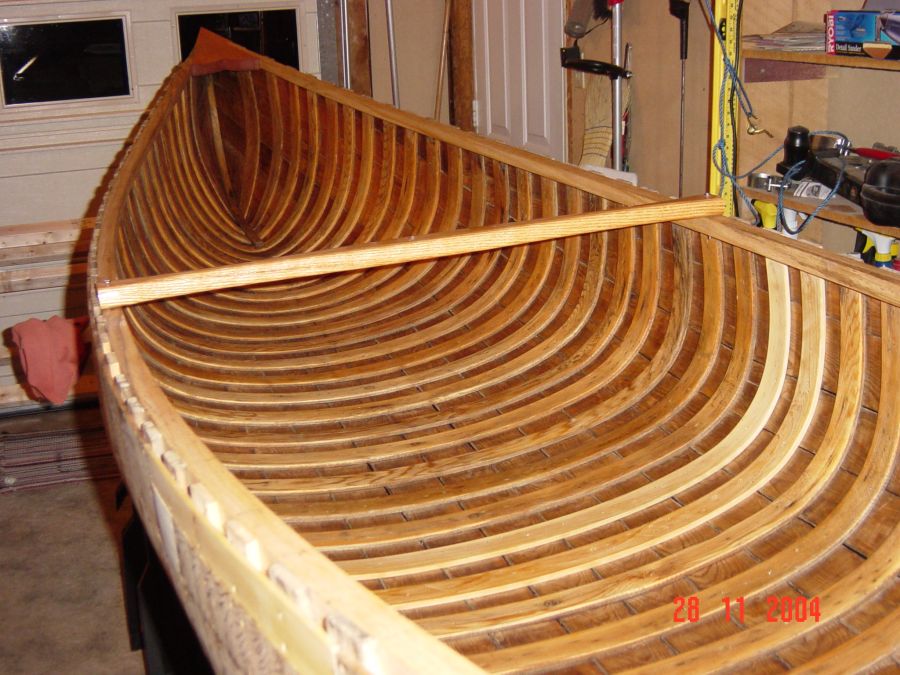 Restored wood and canvas canoes.