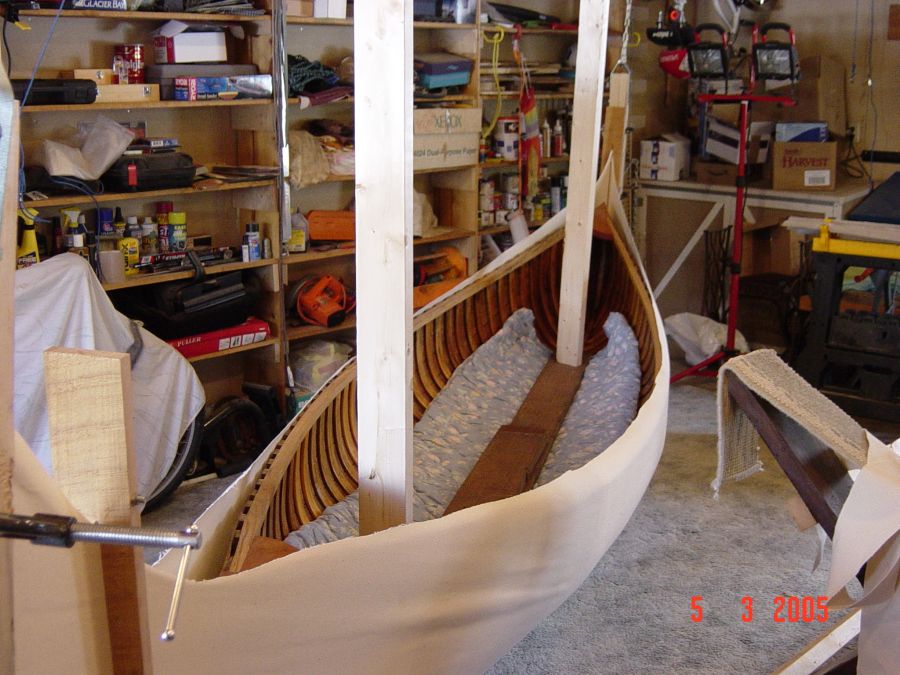 Restored wood and canvas canoes.