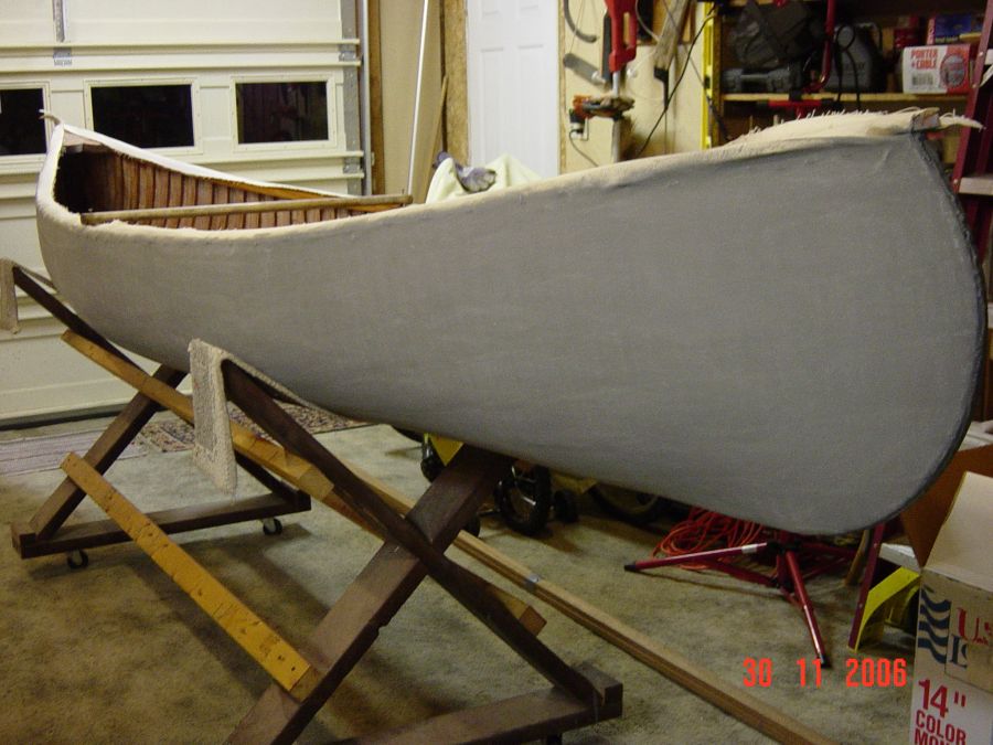 Restored wood and canvas canoes.