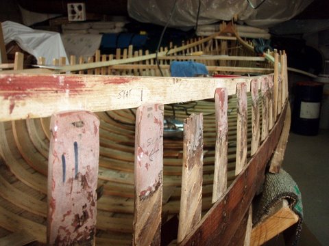 Restored wood and canvas canoes.