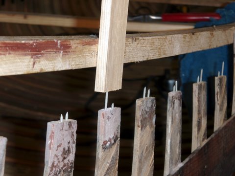 Restored wood and canvas canoes.