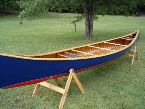 Restored wood and canvas canoes.